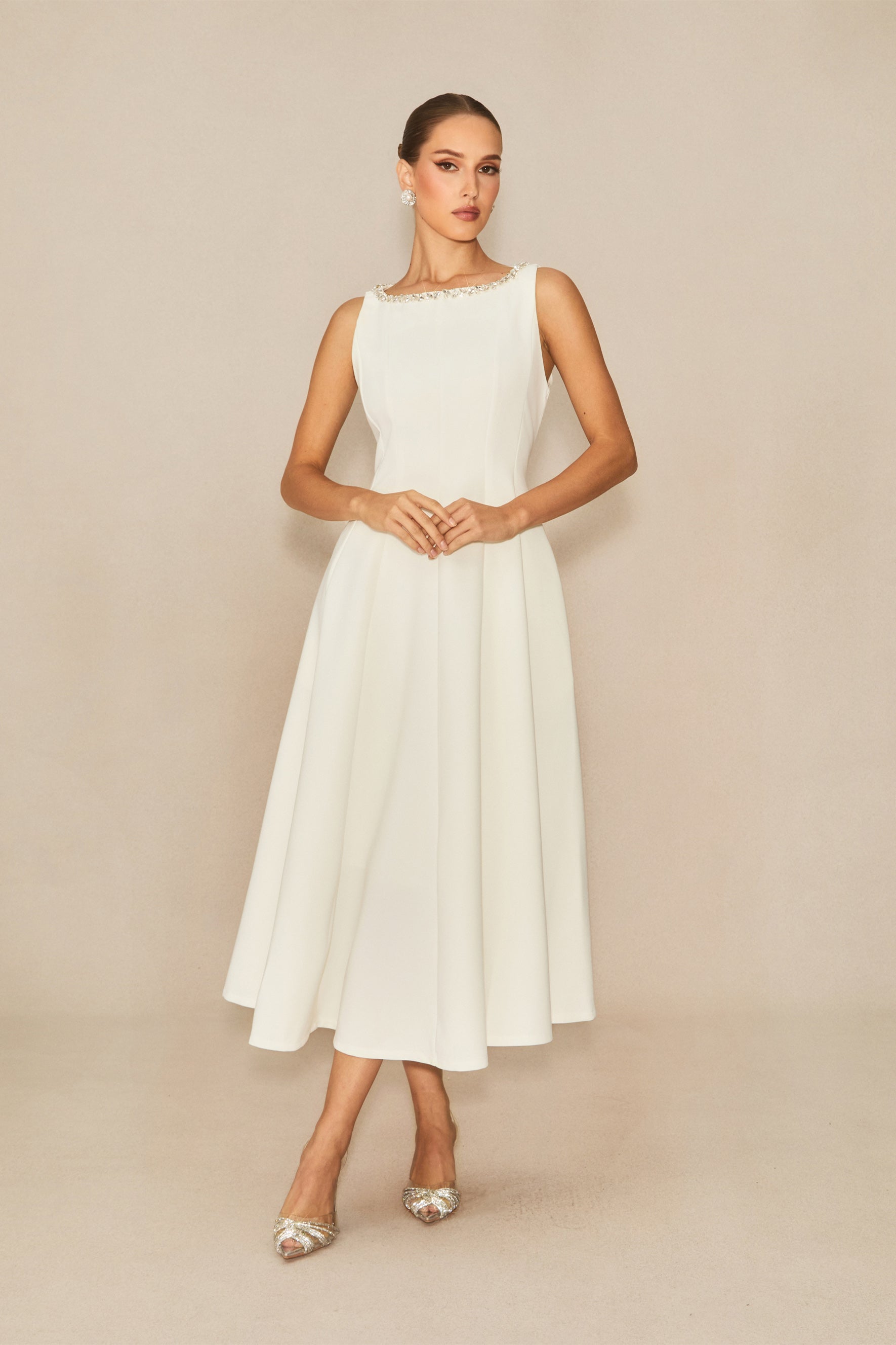 Won your heart with this white embellished sleeveless midi dress