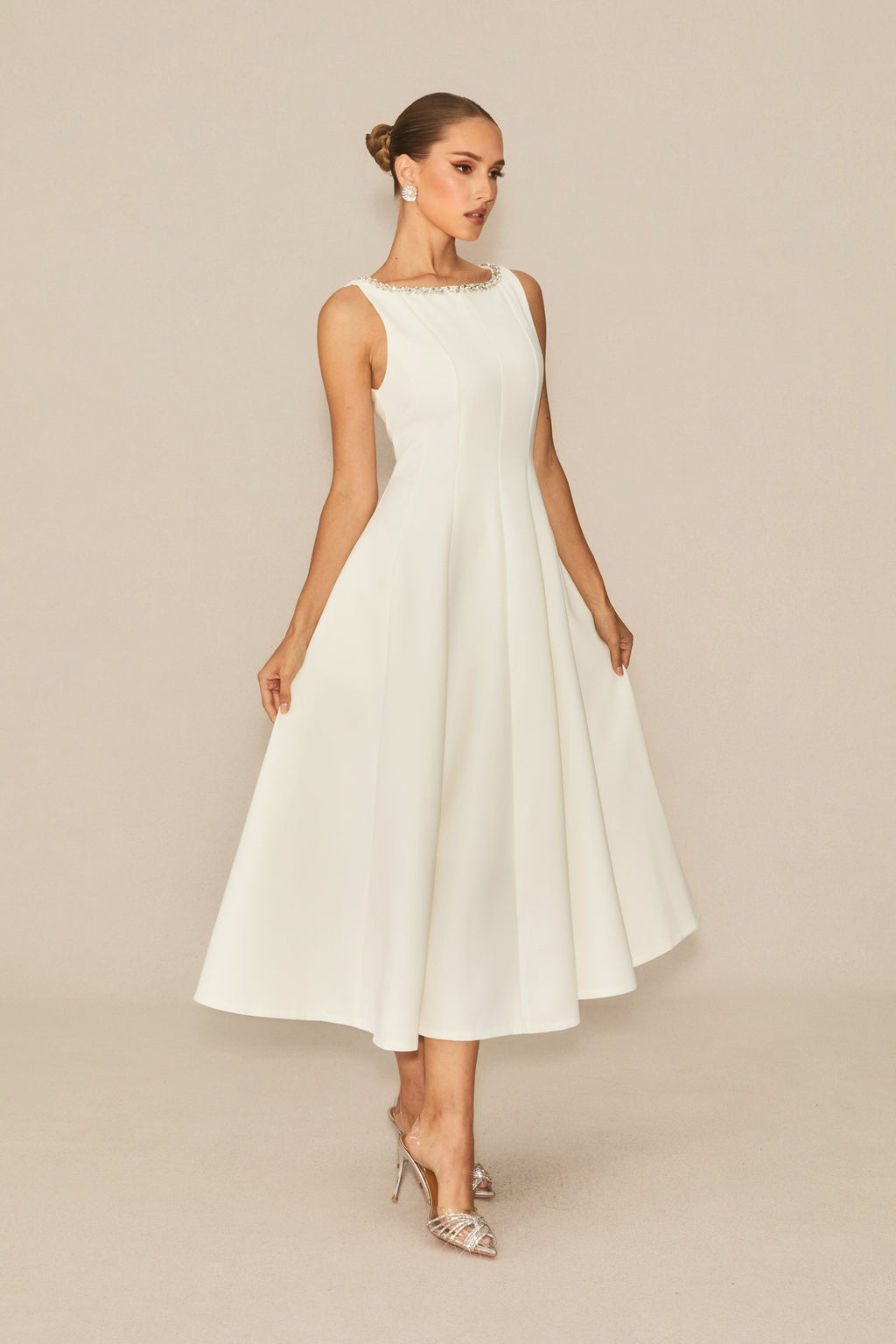 Won your heart with this white embellished sleeveless midi dress