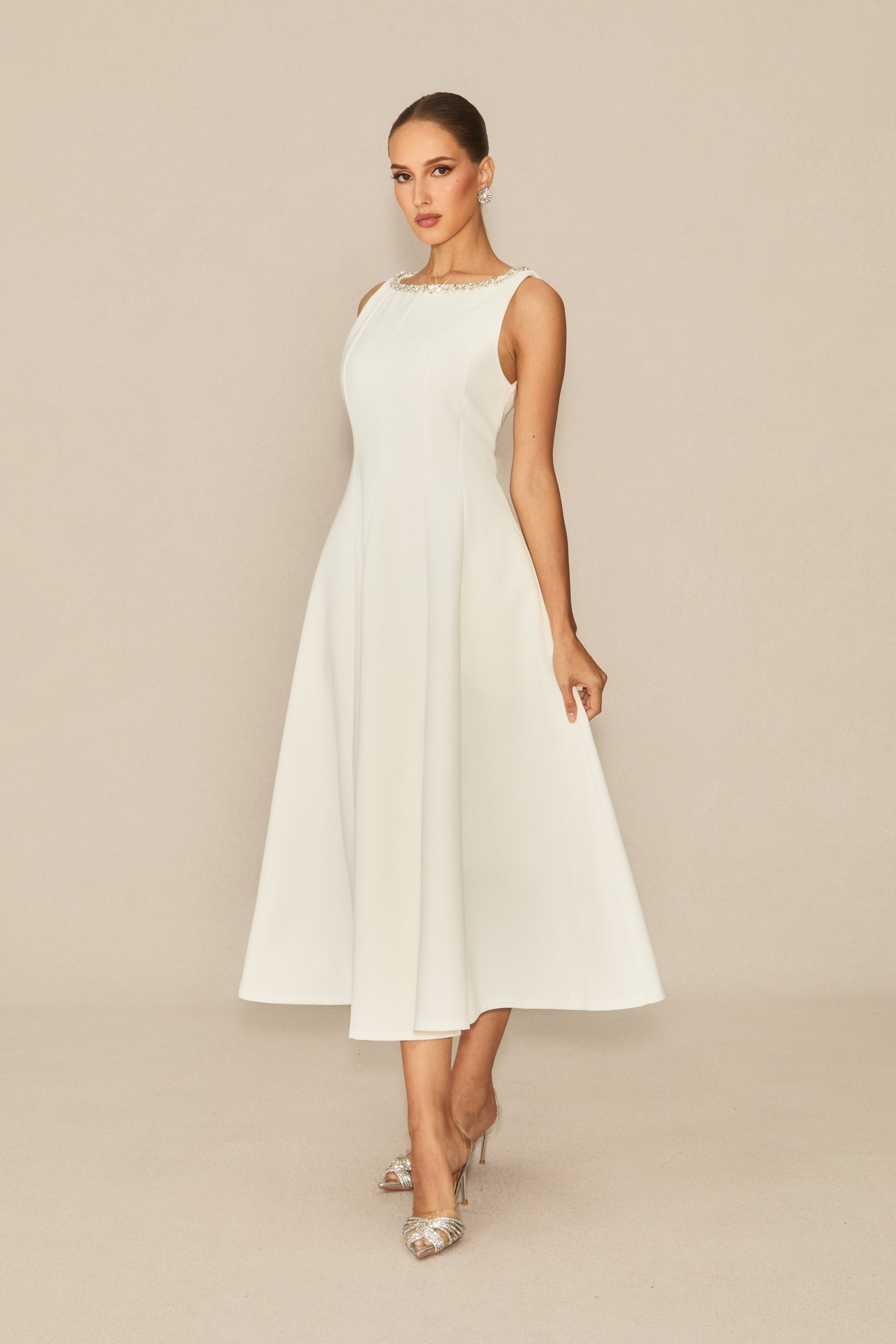 Won your heart with this white embellished sleeveless midi dress