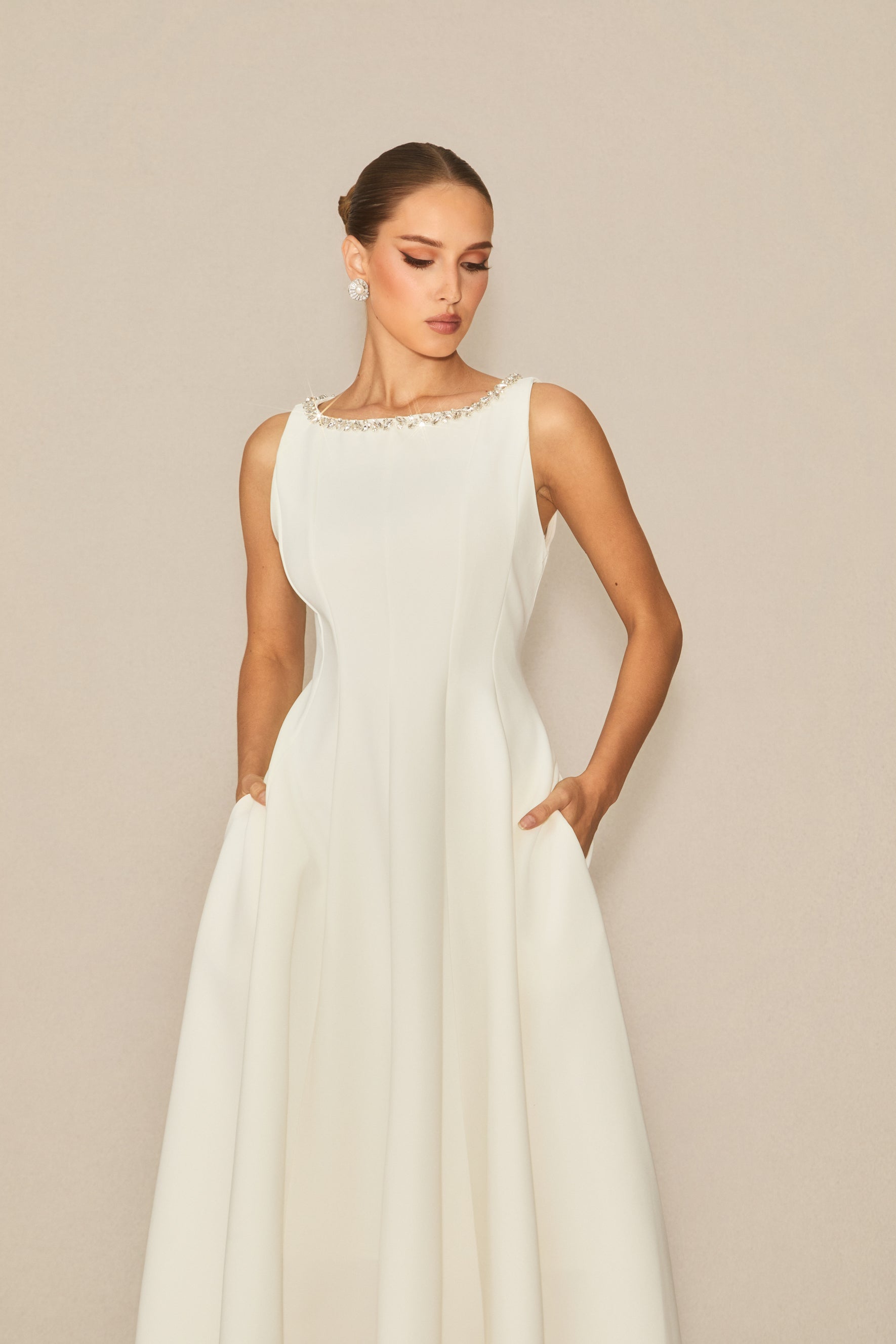 Won your heart with this white embellished sleeveless midi dress