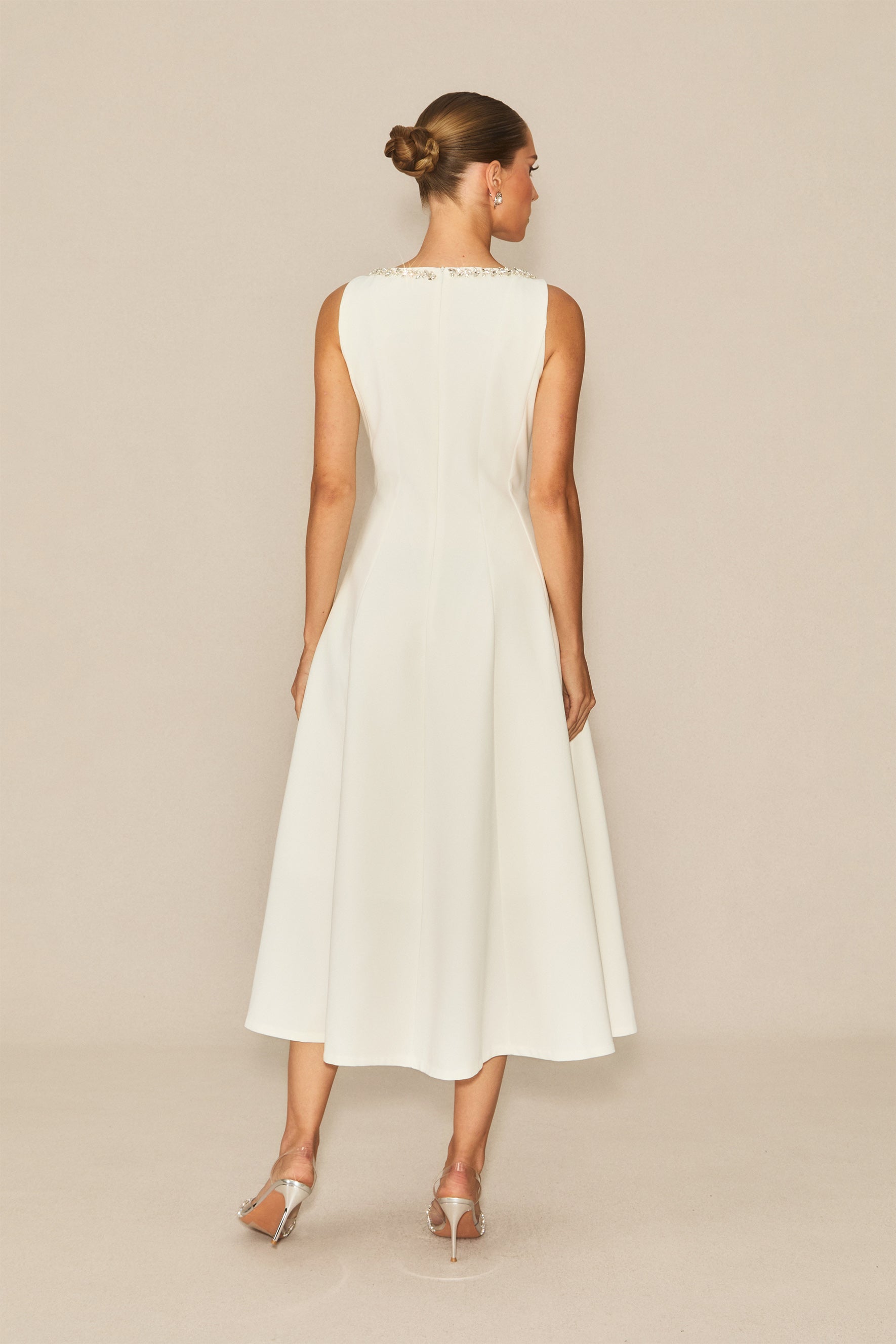 Won your heart with this white embellished sleeveless midi dress